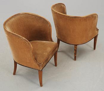 A pair of Nordiska Kompaniet 'Bellman' elm armchairs attributed to Axel Einar Hjorth, Sweden 1929-30.