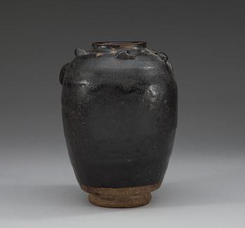 A black and brown glazed jar with a dragon in relief, Song dynasty (960-1279).