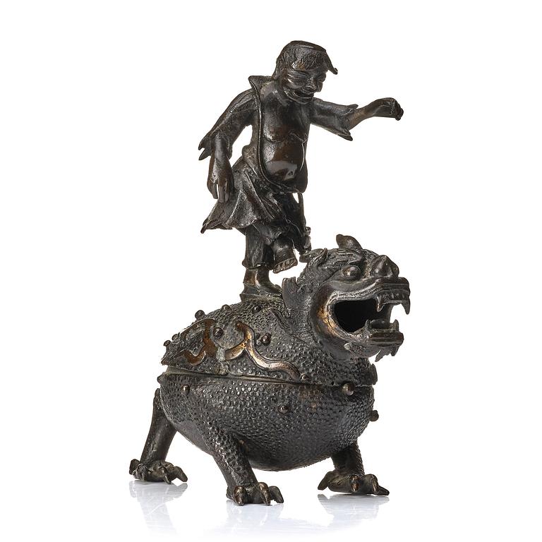 A bronze censer and cover in the shape of  Liu Haichan on the three legged toad, Qing dynasty.