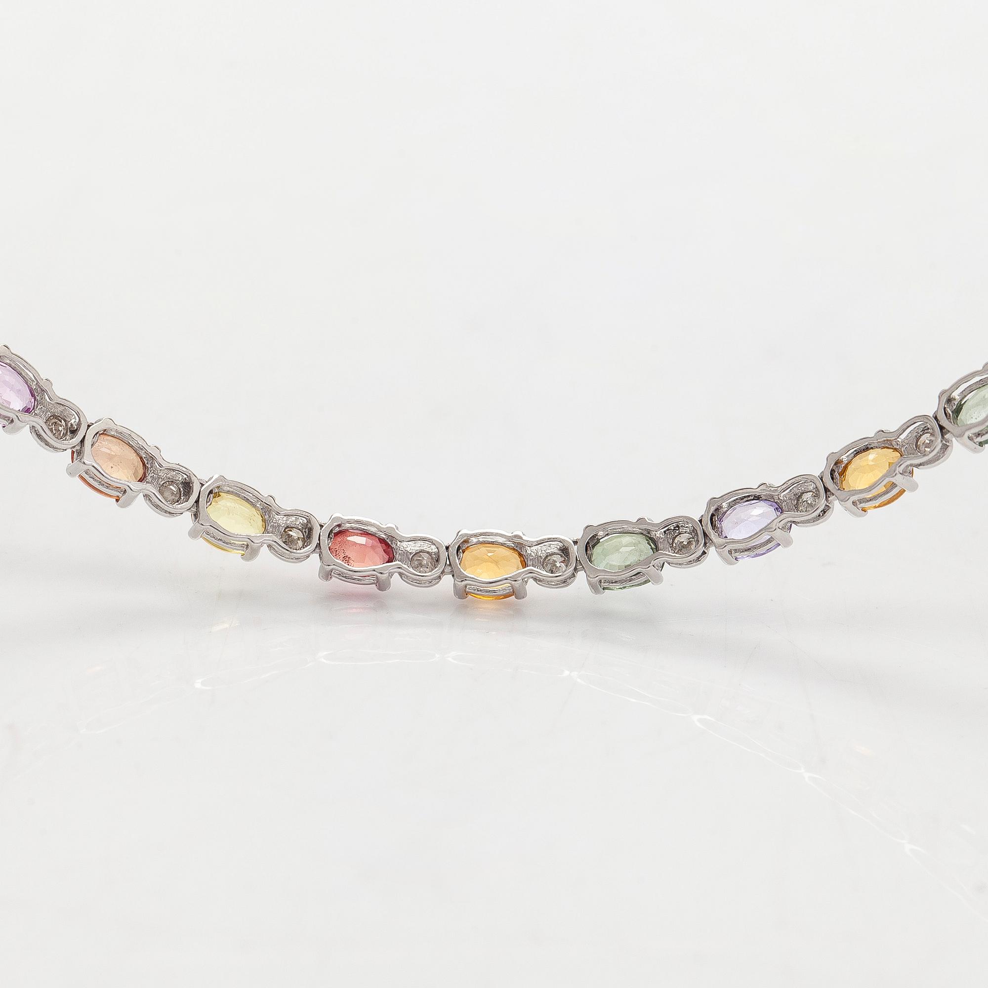 An 18K white gold necklace with multi-coloured sapphires and diamonds.
