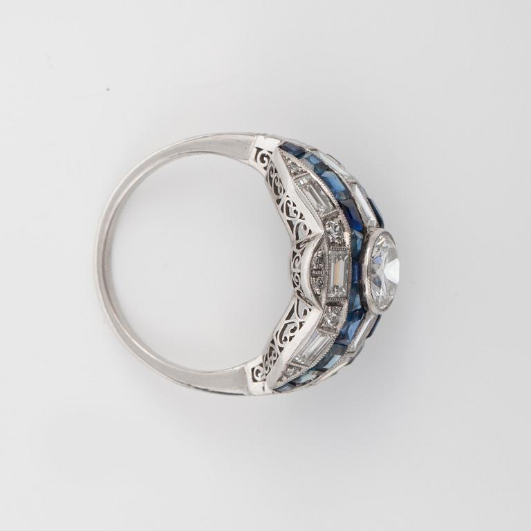 A sapphire and diamond ring. Centre stone circa 0.97 ct according to engraving.