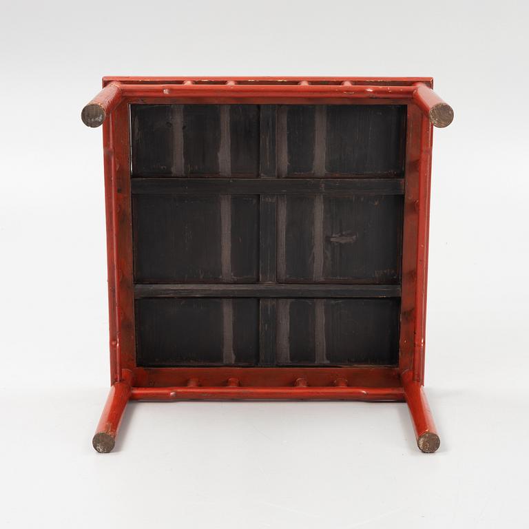 A lacquered table, China, 20th century.