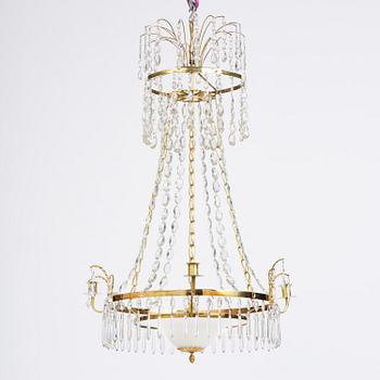 A late Gustavian gilt brass and cut glass four-light chandelier, Stockholm, late 18th century.
