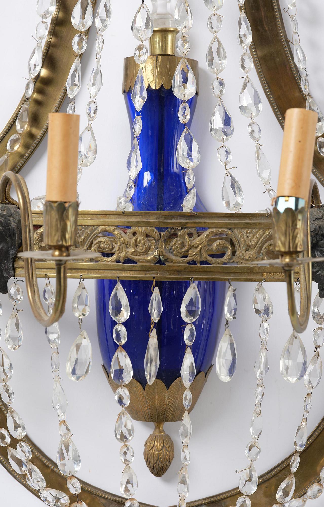 A pair of Russian Louis XVI-style  four-branch gilt bronze appliques, 19th century.