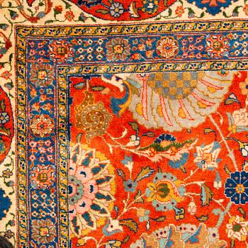 A carpet, a semi-antique Tabriz, ca 528-535 x 346,5-352,5 cm, signed Farhan.