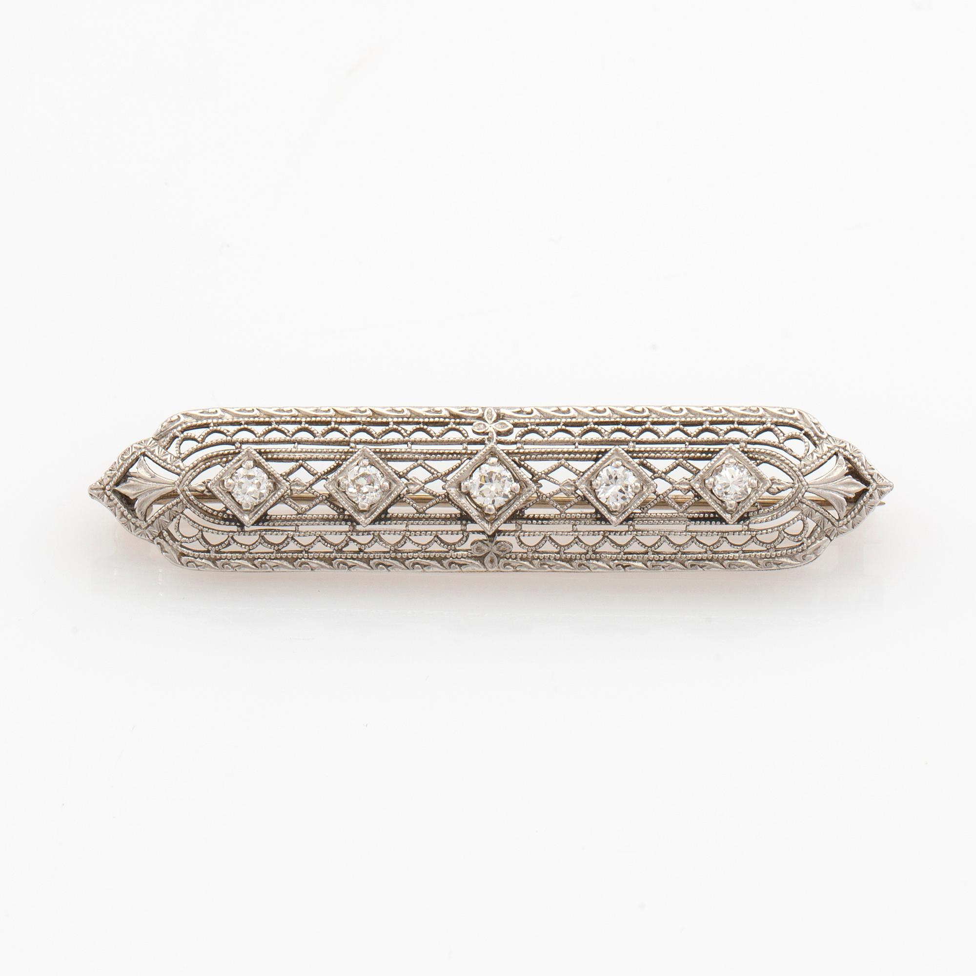 Brooch 14K white gold with round old-cut diamonds.