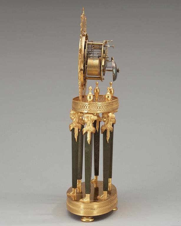 A French Empire gilt bronze mantel clock by L Grognot.