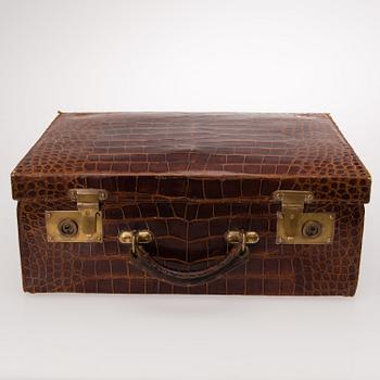 A TRAVEL TOILET CASE, leather, German 1910-20s, boxes with silver lid.