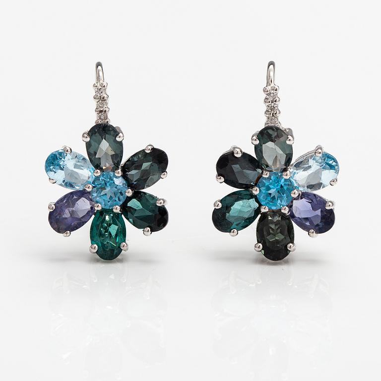 A pair of 14K white gold earrings with tpoazes, cordierites and tourmalines.