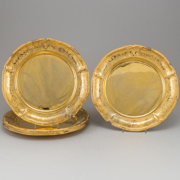 A set of nine silver-gilt sterling plates, Mexico 20th century. Rococo-style.