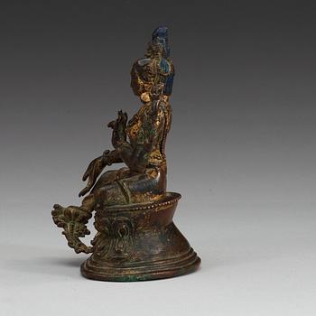 A Sinotibetan gilt bronze figure of green Tara, 18th/19th Century.