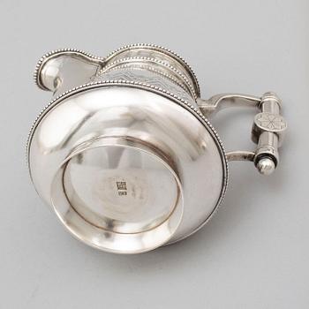 A Russian 19th century parcel-gilt silver tea pot and cream jug, mark possbly of Alexander Lokin, St. Petersburg 1893.