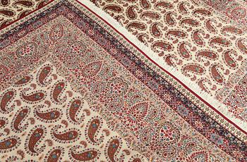 A Kirman carpet, signed, c. 390 x 295 cm.