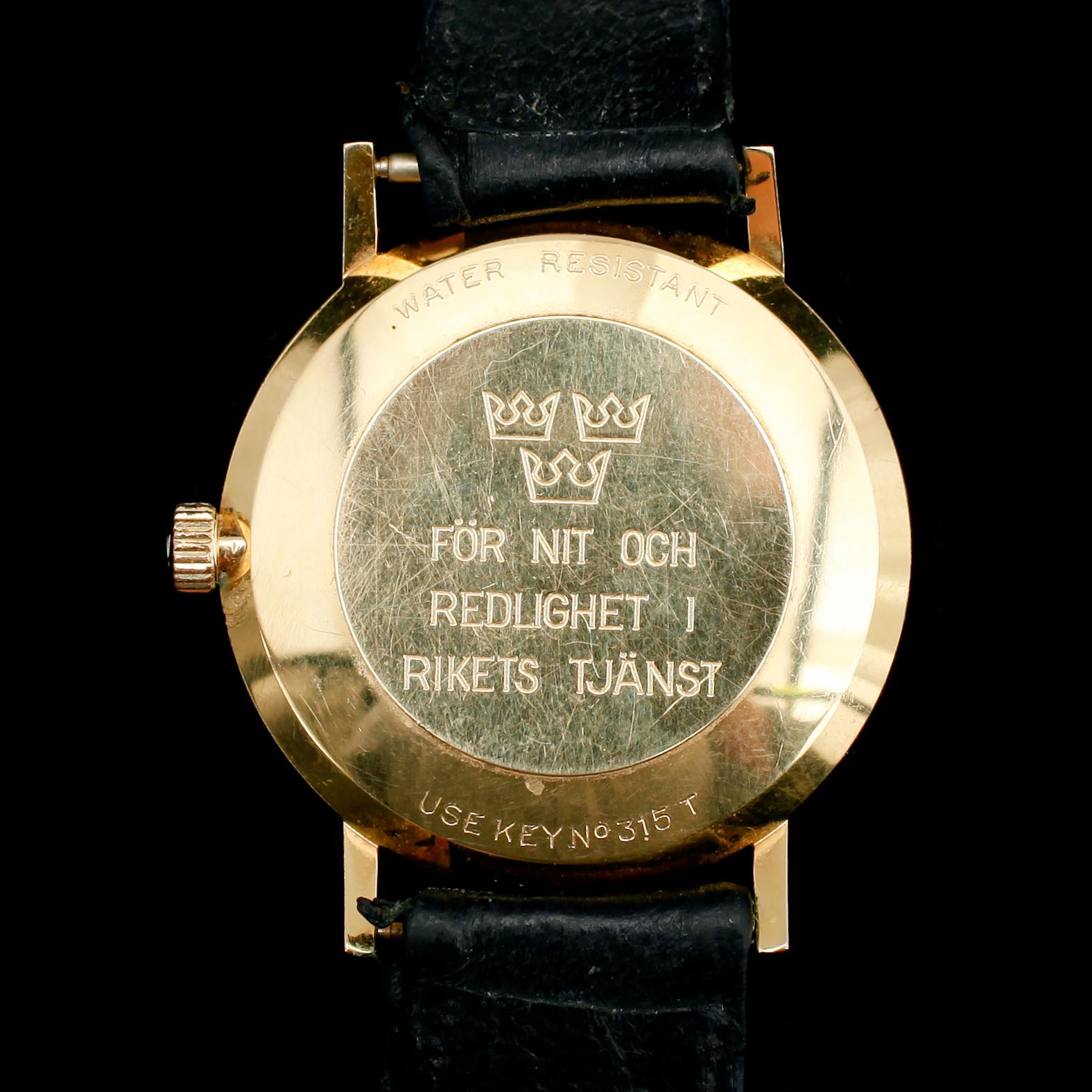 HERRARMBANDSUR, 18 k guld, Tissot Seastar Seven.