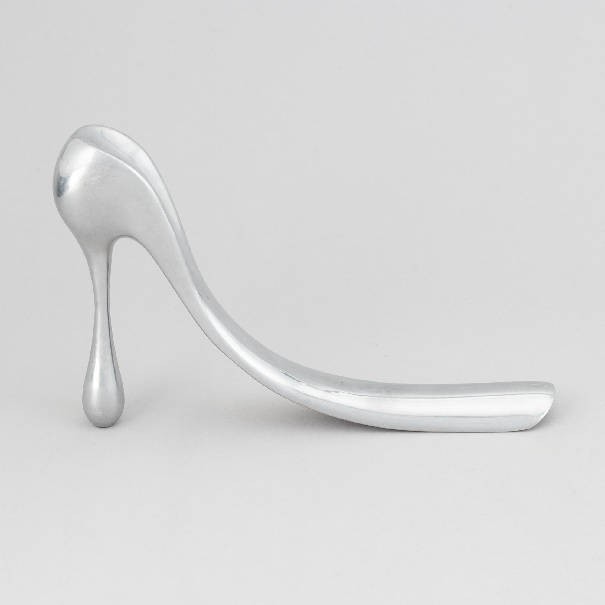 Manolo Blahnik, a metal shoe horn, 21st century.