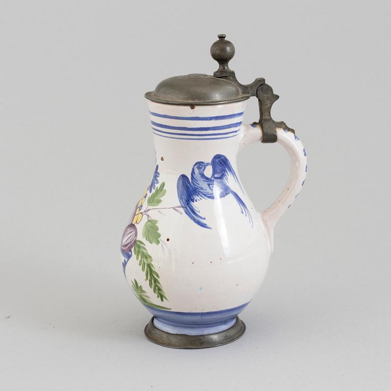 AN 18TH CENTURY FAYENCE AND PEWTER JUG.