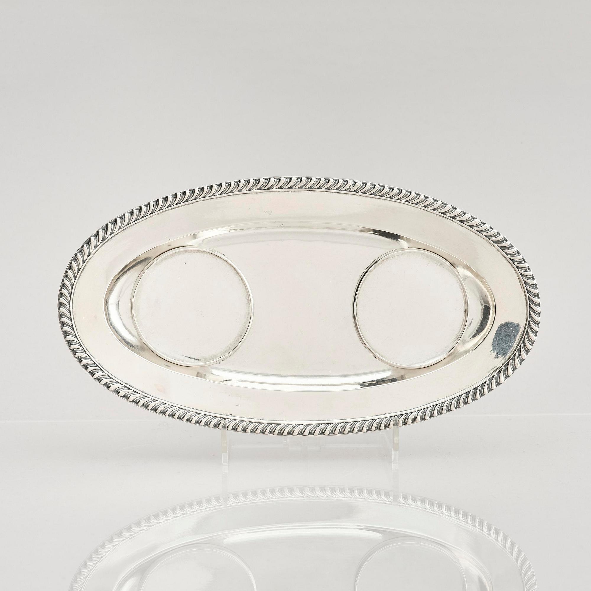 A pair of Swedish parcel-gilt silver dessert bowls with stand, mark of Gustaf Möllenborg, Stockholm 1830.