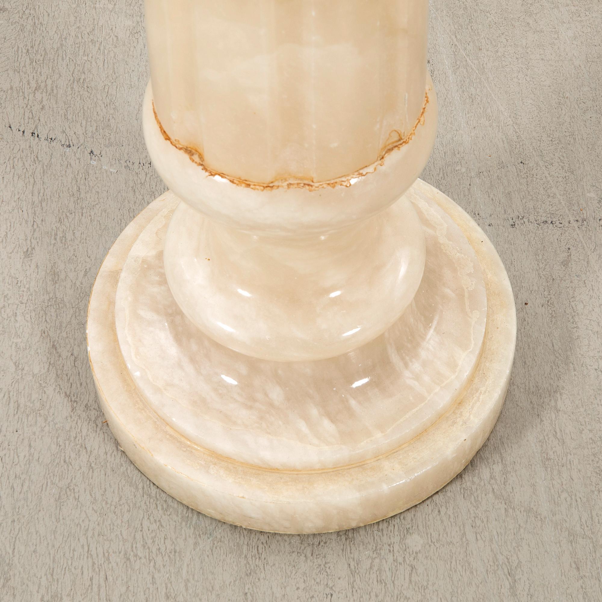 An alabaster pedestal later part of the 20th century.