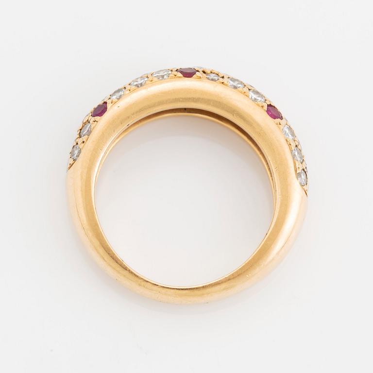 An 18K gold Cartier ring set with round brilliant-cut diamonds and rubies.