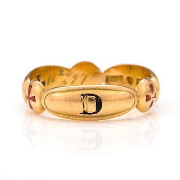 An 18K gold Masonic ring.