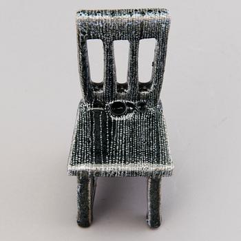 HEINI RIITAHUHTA, a porcelain miniature sculpture 'Chair' signed Heini Riitahuhta.