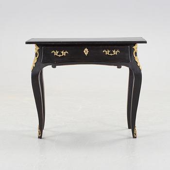 A table in the rococo style, first half of 20th century.