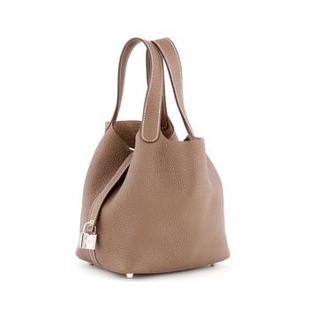 669. HERMÈS, a étoupe leather bag, "Picotin Lock PM".