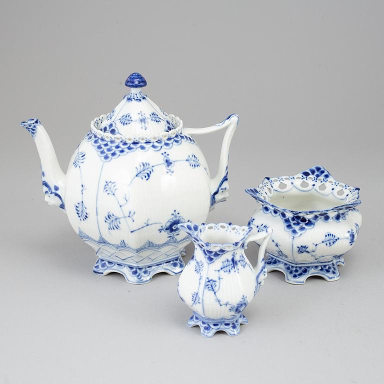 ROYAL COPENHAGEN, a 'Musselmalet Full Lace' porcelain teapot, creamer and sugarbowl, Denmark.