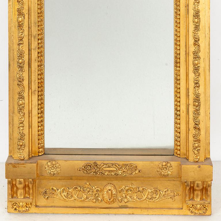 A giltwood Empire mirror by J. M. Berg (active in Gothenburg 1803- ca 1837).