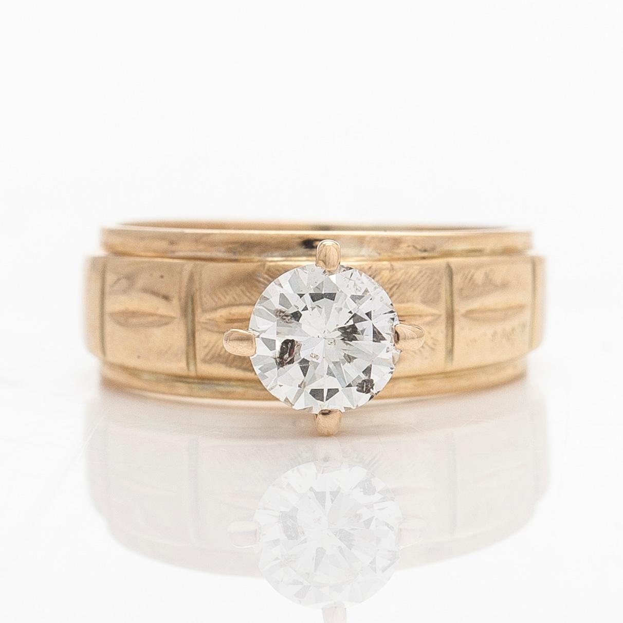 A 14K gold ring, set with a brilliant-cut diamond.