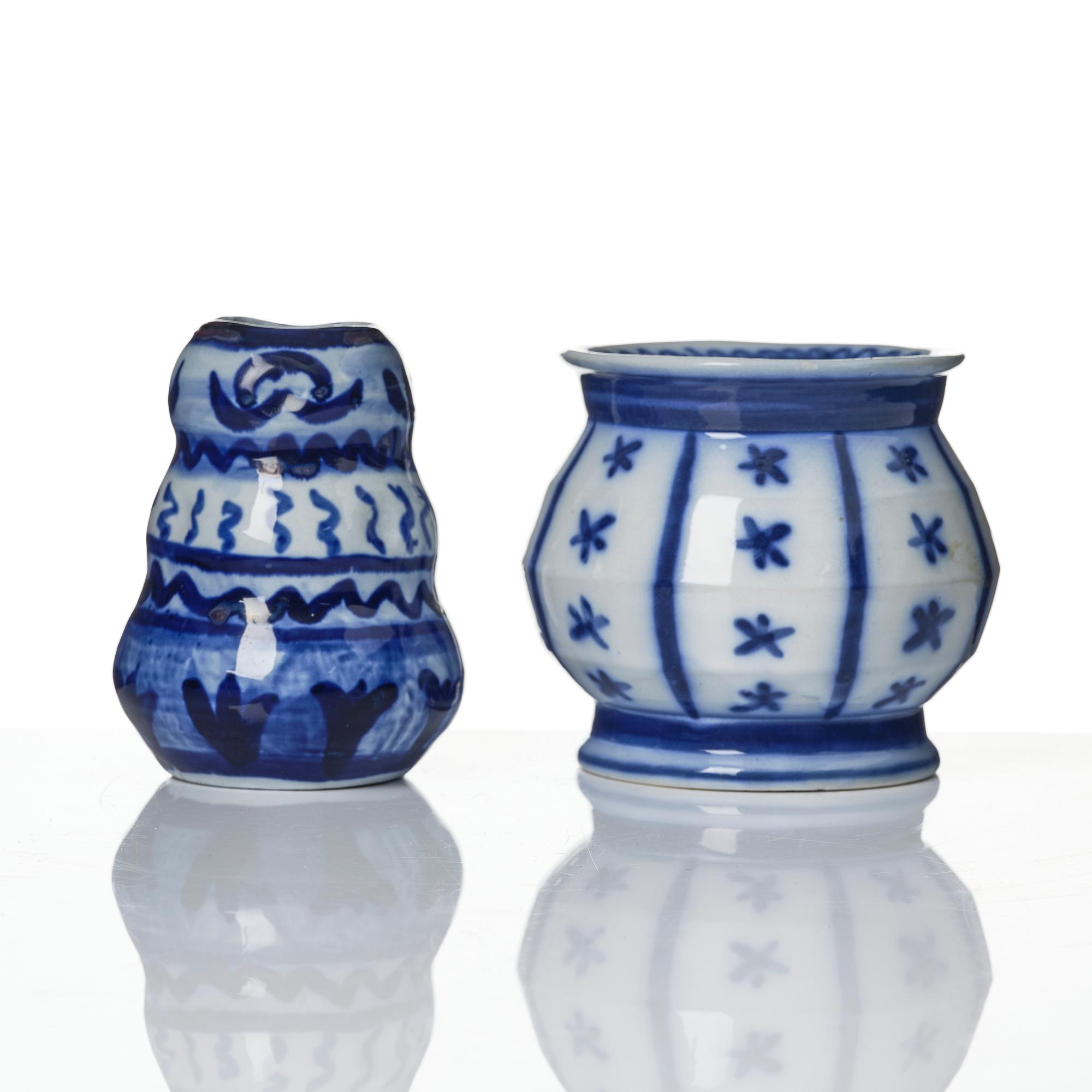 Wilhelm Kåge, a jar with cover, and four vases, creamware and porcelain, Gustavsberg, Sweden, 1917-1920.