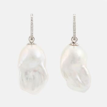 Baroque freshwater pearl and brilliant cut diamond earrings.