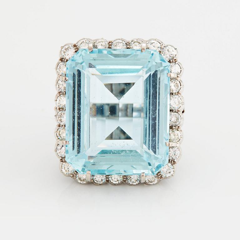 A RING set with an aquamarine and brilliant-cut diamonds.