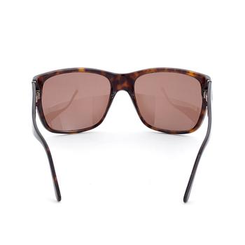 PRADA, a pair of sunglasses.
