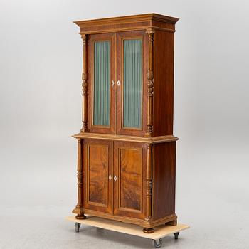 A book cabinet, around the year 1900.