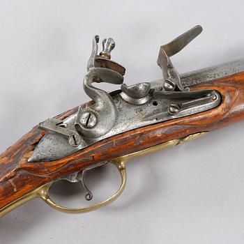 A flintlock rifle, 18th century.