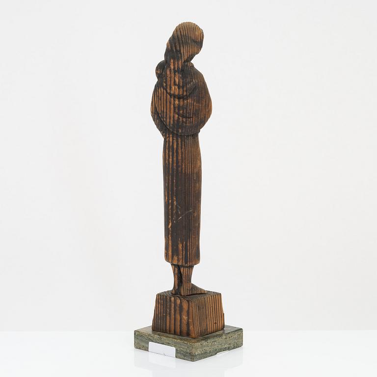 Gunnar Uotila, a wooden sculpture, signed and dated 1943.