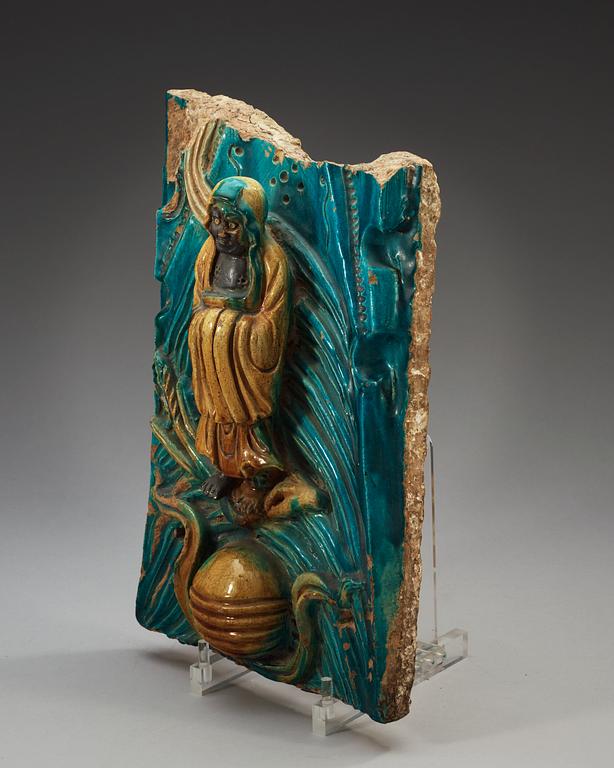 A turquoise and yellow glazed tile piece, Ming dynasty, 17th Century.