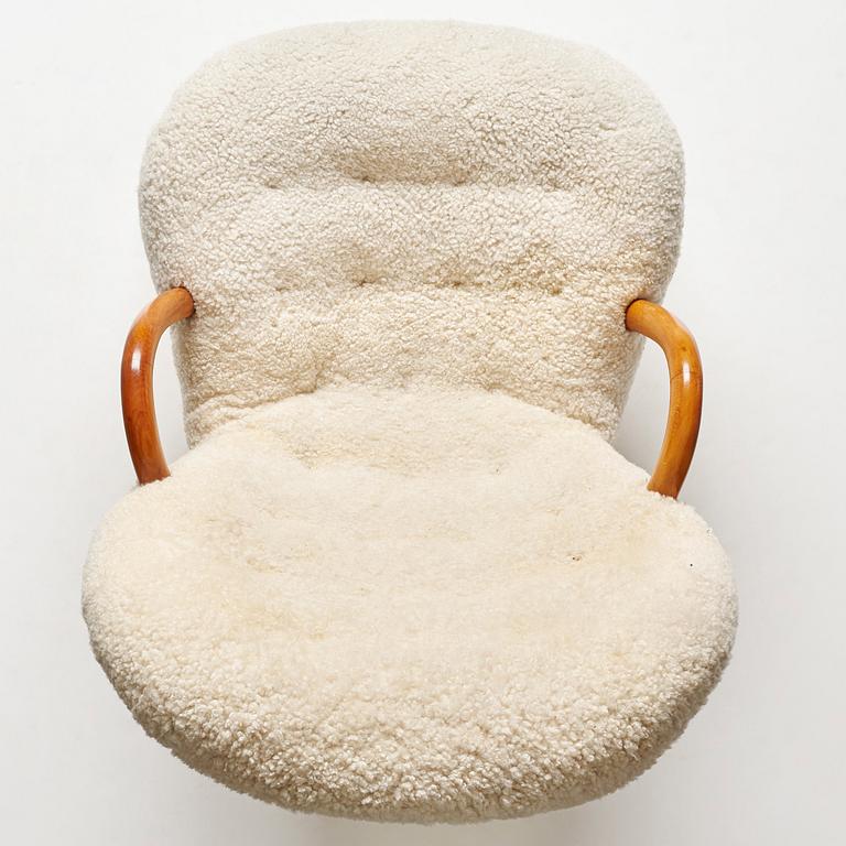 Philip Arctander, attributed to, a Clam Chair re-upholstered in white sheepskin, executed or sold by Vik & Blindheim Norway.