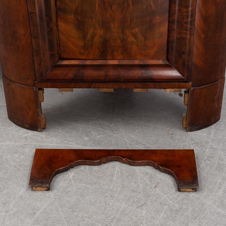 A pair of mahogany corner cabinets, mid 19th Century.