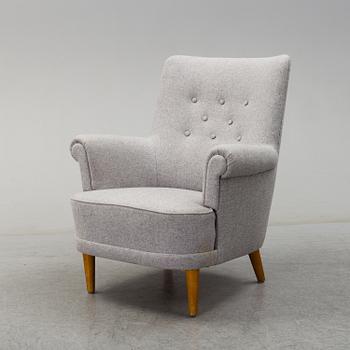 A 'Hemmakväll' easy chair by Carl Malmsten, late 20th century.