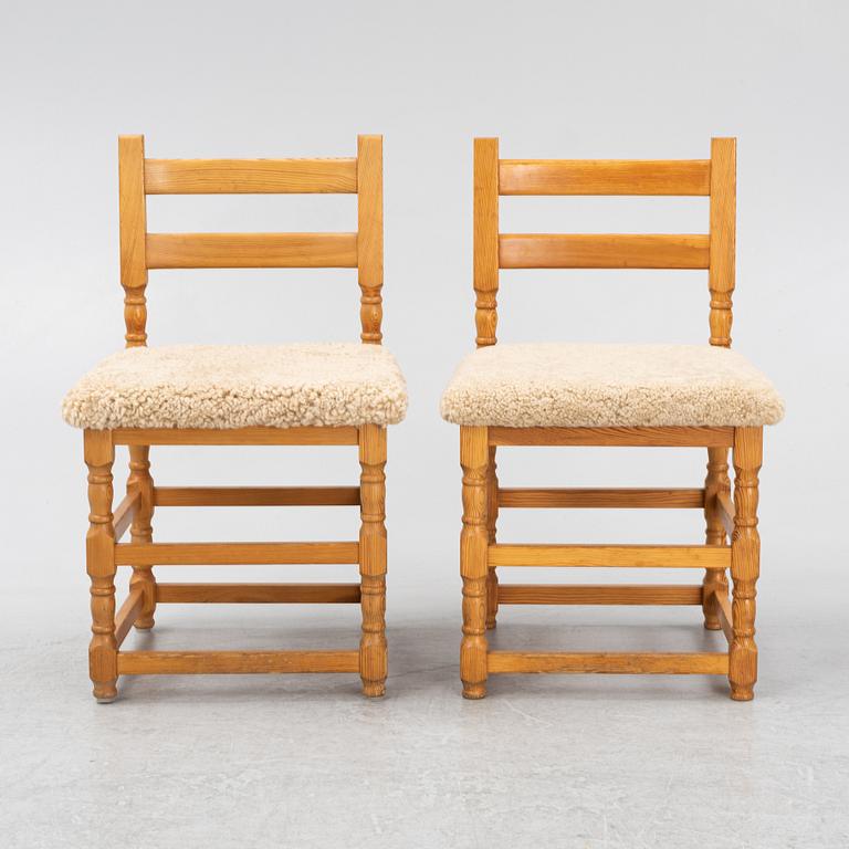 A set of eight pine chairs with new sheepskin upholstery, 1970s.