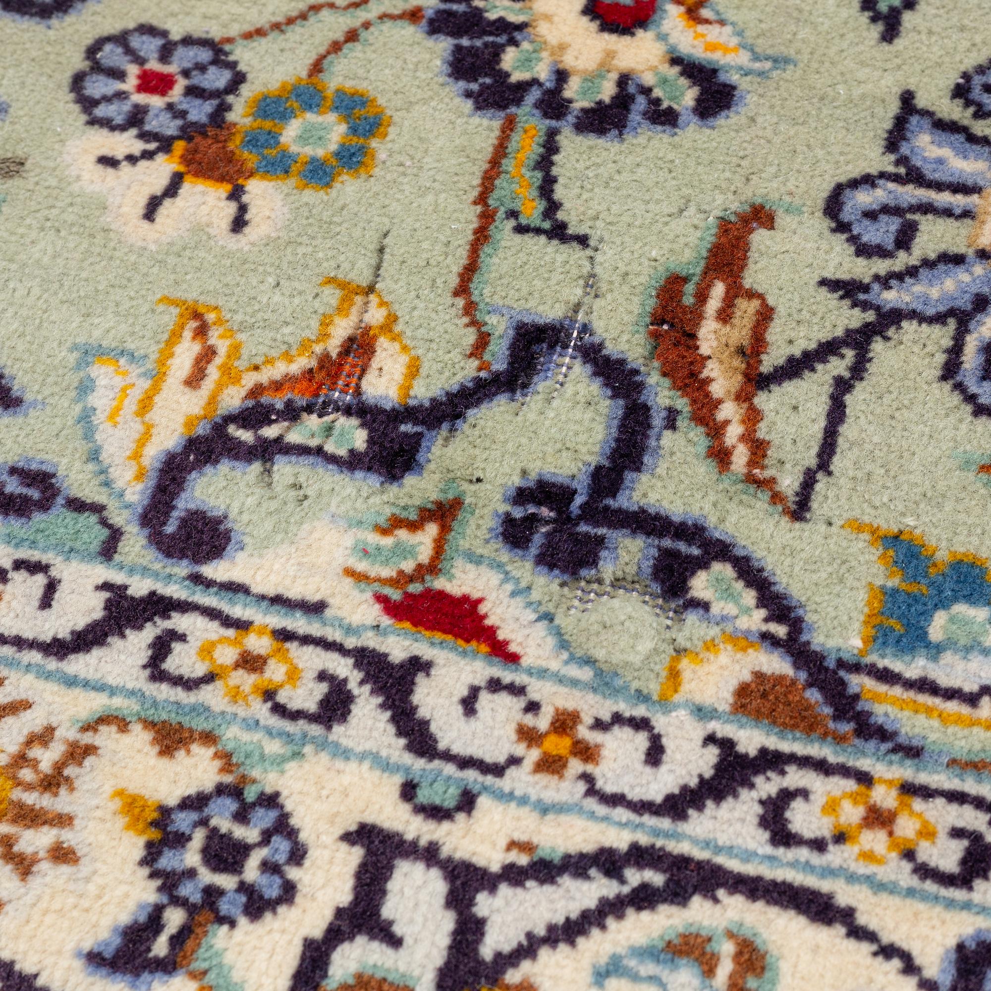 A Keshan carpet, signed, c. 410 x 297 cm.