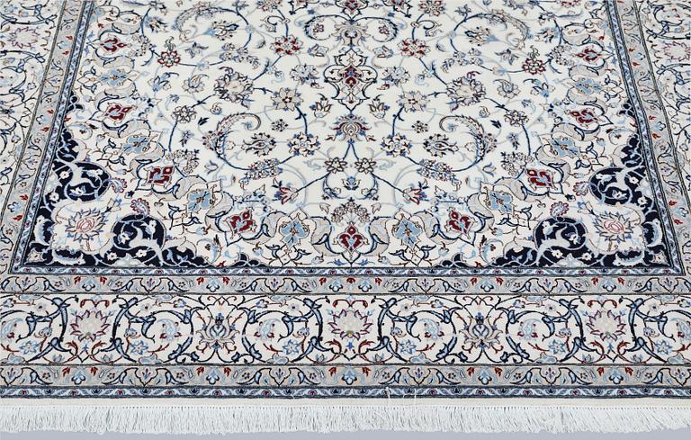 A Nain carpet, part silk, so called 6LAA, approximately 279 x 200 cm.