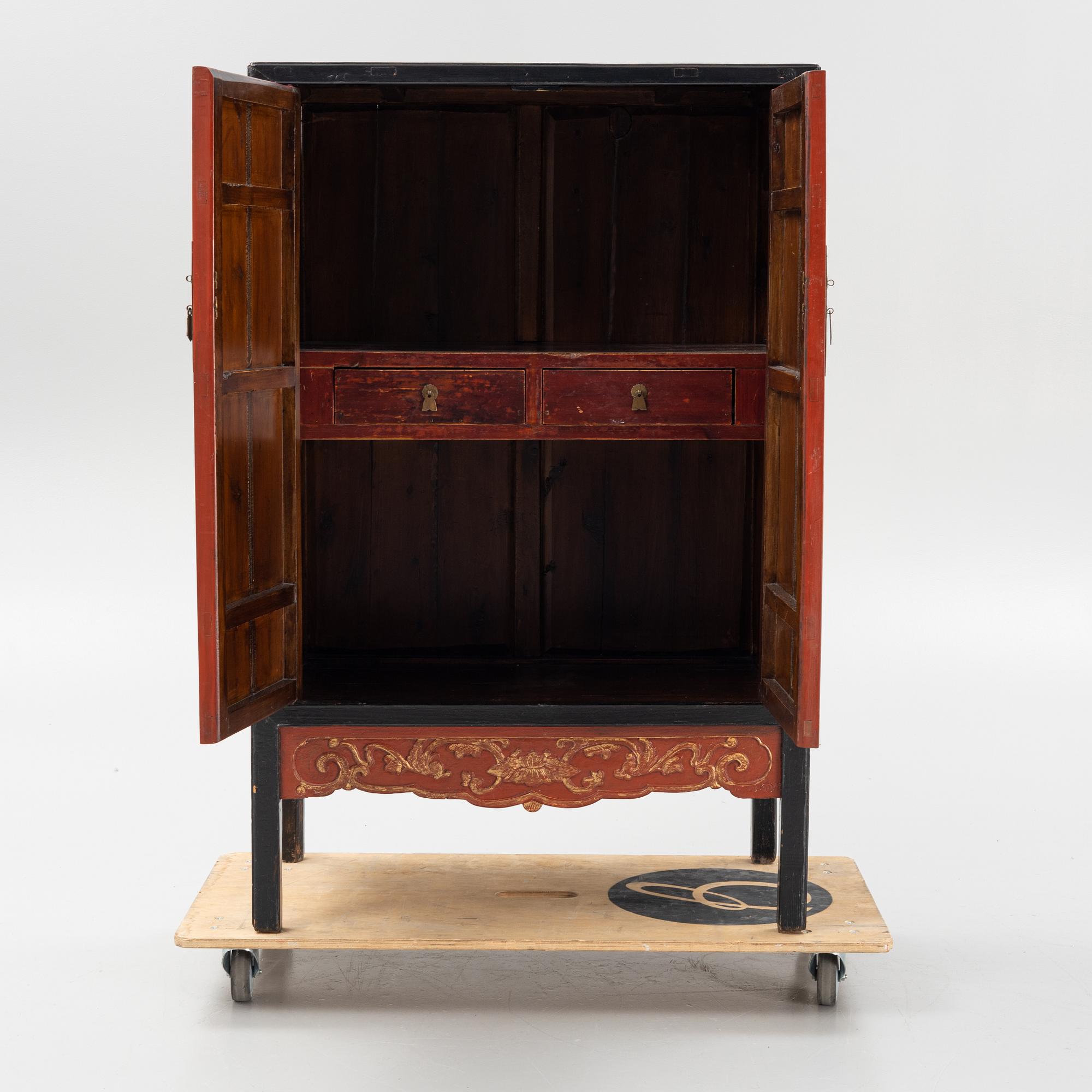 A Chinese lacquered cabinet, 20th century.