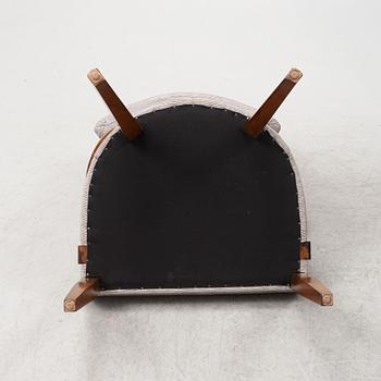 A pair of stained beech armchairs, 20th Century.