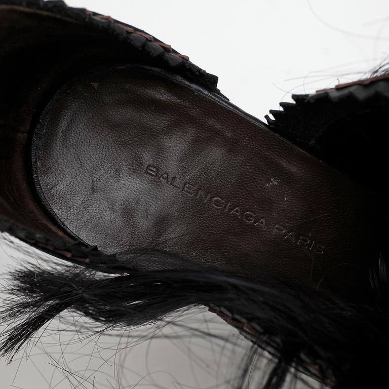 BALENCIAGA, a pair of brown and black leather sandalettes with pony hair.