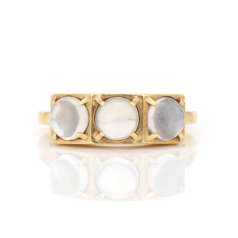 A ring by Wiwen Nilsson set with round, cabochon-cut moonstones.n.