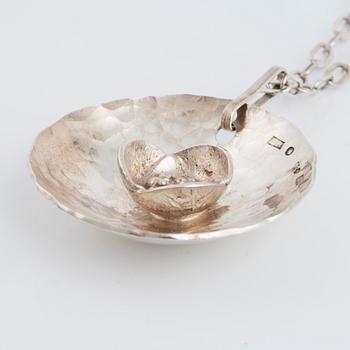ROSA TAIKON a silver necklace.