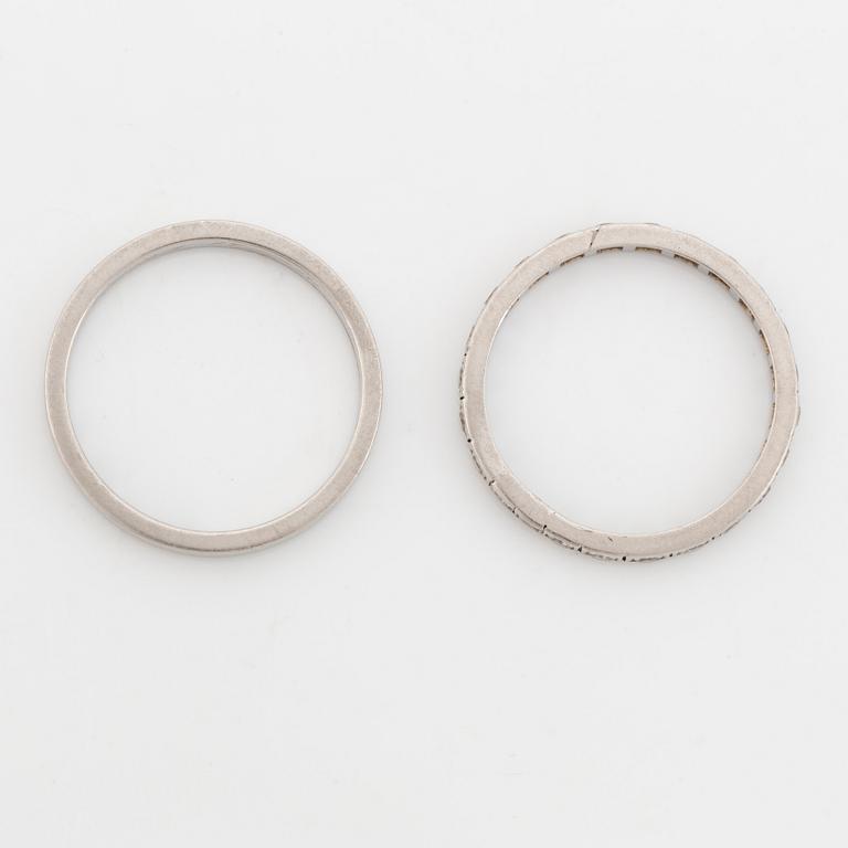 Two  platinum rings, one with eight cut diamonds.